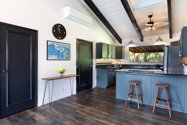 75-5811 Nani Kailua Pl, Kailua-Kona, HI 96740 - kitchen with an AC wall unit, a peninsula, dark countertops, a kitchen bar, and dark wood-style flooring
