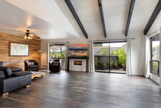 75-5811 Nani Kailua Pl, Kailua-Kona, HI 96740 - living room with healthy amount of natural light, wooden walls, wood finished floors, ceiling fan, and baseboards