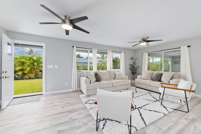 15-2804 Maikoiko St, Pahoa, HI 96778 - living room with a ceiling fan, light wood-type flooring, plenty of natural light, and baseboards