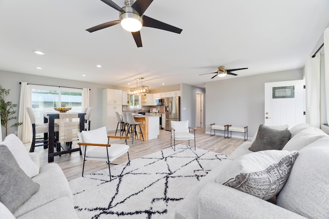 15-2804 Maikoiko St, Pahoa, HI 96778 - living area featuring a ceiling fan, recessed lighting, light wood-type flooring, baseboards, and a chandelier