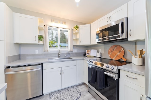 15-2804 Maikoiko St, Pahoa, HI 96778 - kitchen with stainless steel appliances, open shelves, a sink, white cabinets, and light countertops