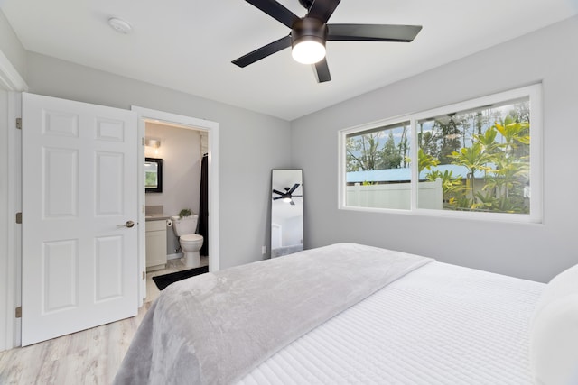 15-2804 Maikoiko St, Pahoa, HI 96778 - bedroom featuring light wood-style flooring, connected bathroom, and a ceiling fan