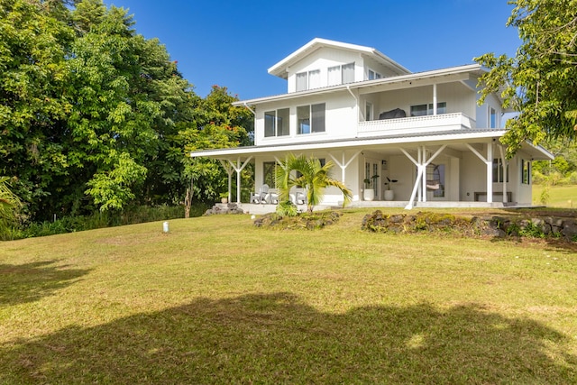 27-571 Kalaoa Camp Rd, Papaikou, HI 96781 - view of front of home featuring a balcony, a front lawn, and a porch
