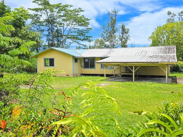 13-3403 Kumakahi St, Pahoa, HI 96778 - rear view of house with a metal roof, crawl space, a lawn, and a carport