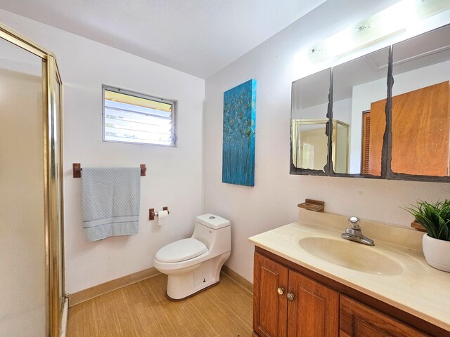 13-3403 Kumakahi St, Pahoa, HI 96778 - bathroom featuring vanity, a shower stall, and wood finished floors
