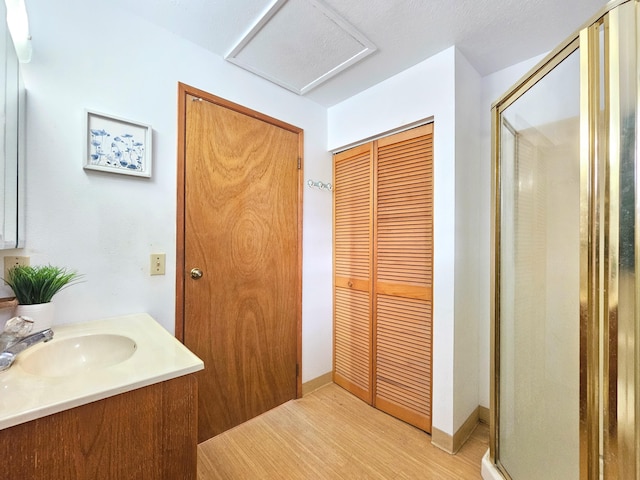 13-3403 Kumakahi St, Pahoa, HI 96778 - bathroom featuring a closet, a stall shower, vanity, and wood finished floors