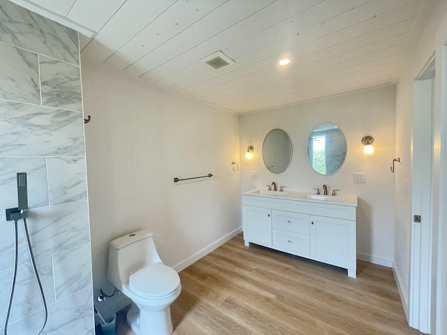 94-6707 Kamaoa Rd, Naalehu, HI 96772 - full bath with double vanity, wooden ceiling, wood finished floors, toilet, and baseboards