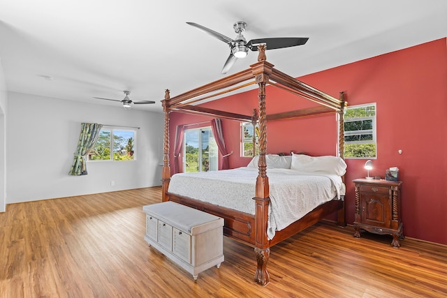 16-2028 35th Ave, Keaau, HI 96749 - bedroom featuring access to exterior, wood finished floors, and a ceiling fan