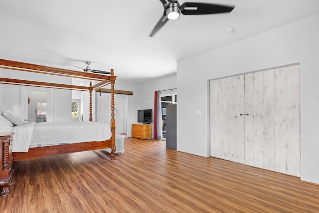 16-2028 35th Ave, Keaau, HI 96749 - unfurnished bedroom featuring wood finished floors and a ceiling fan