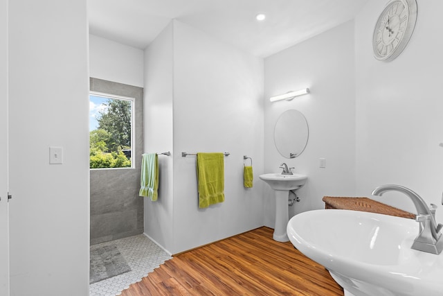 16-2028 35th Ave, Keaau, HI 96749 - bathroom with a sink, wood finished floors, tiled shower, and recessed lighting