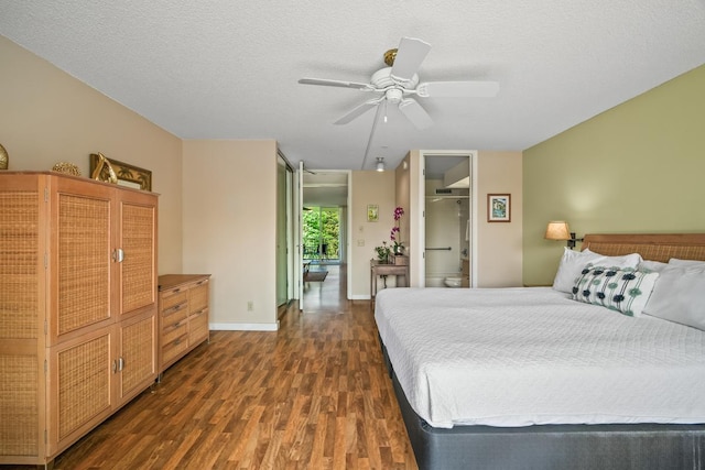 3811 Edward Rd Unit 1206, Princeville, HI 96722 - bedroom with dark wood-style flooring, a ceiling fan, and baseboards