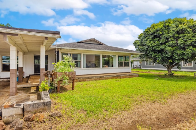 242 Koili Ln, Kapaa, HI 96746 - back of house featuring a yard