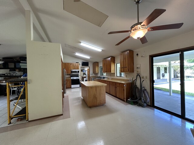 16-1397 35th Ave, Keaau, HI 96749 - kitchen with a kitchen island, lofted ceiling, stainless steel appliances, light countertops, and a ceiling fan