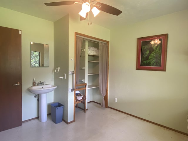16-1397 35th Ave, Keaau, HI 96749 - bathroom with a ceiling fan, a sink, and baseboards