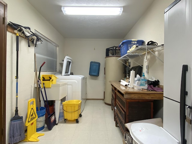 16-1397 35th Ave, Keaau, HI 96749 - washroom featuring gas water heater, tile patterned floors, and washer and clothes dryer