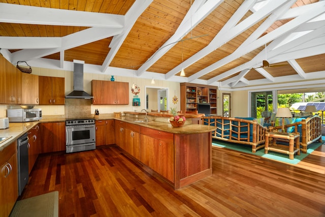 7205 Alealea Rd, Hanalei, HI 96722 - kitchen with appliances with stainless steel finishes, wall chimney range hood, a peninsula, a sink, and brown cabinets