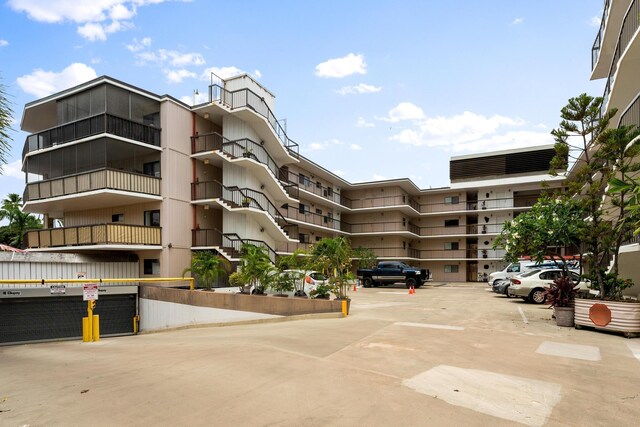 75-5719 Alii Dr Unit 220, Kailua-Kona, HI 96740 - view of apartment building / complex with uncovered parking