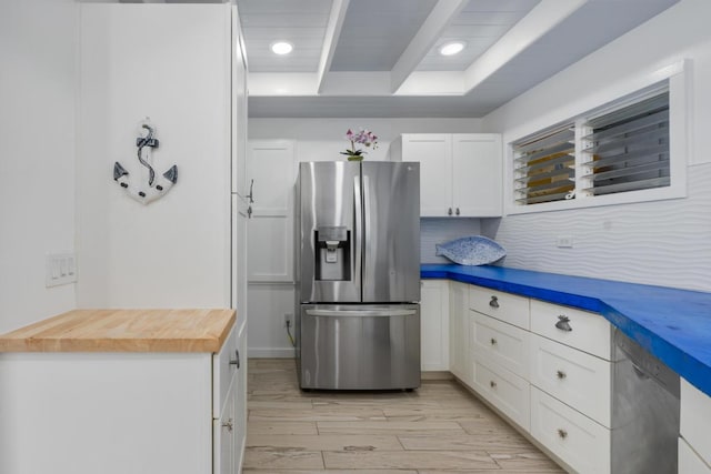 75-6150 Alii Dr Unit 7, Kailua-Kona, HI 96740 - kitchen with stainless steel refrigerator with ice dispenser, butcher block counters, white cabinetry, light wood-style floors, and recessed lighting