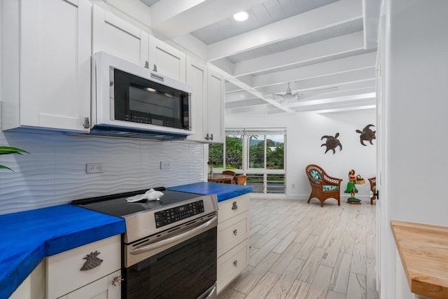 75-6150 Alii Dr Unit 7, Kailua-Kona, HI 96740 - kitchen with electric stove, beamed ceiling, tasteful backsplash, white cabinetry, and light wood-type flooring