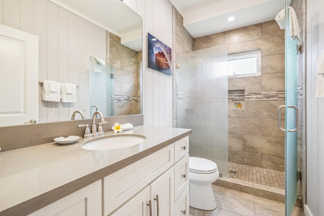 2650 Halalu St, Koloa, HI 96756 - bathroom featuring toilet, vanity, a shower stall, and tile patterned floors