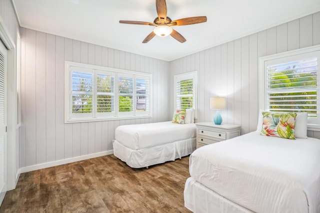2650 Halalu St, Koloa, HI 96756 - bedroom featuring wood finished floors, baseboards, a ceiling fan, and a closet