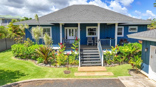 2650 Halalu St, Koloa, HI 96756 - bungalow-style home with a shingled roof, board and batten siding, and a front yard