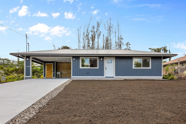 16-2168 Tree Fern Dr, Pahoa, HI 96778 - single story home with metal roof and concrete driveway