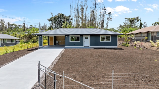 16-2168 Tree Fern Dr, Pahoa, HI 96778 - view of front of house with driveway, metal roof, and a carport