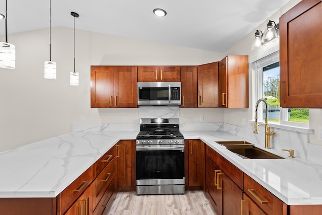16-2168 Tree Fern Dr, Pahoa, HI 96778 - kitchen with stainless steel appliances, vaulted ceiling, a sink, a peninsula, and light stone counters