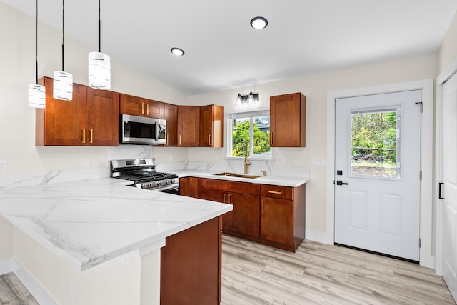 16-2168 Tree Fern Dr, Pahoa, HI 96778 - kitchen featuring appliances with stainless steel finishes, a sink, a peninsula, plenty of natural light, and lofted ceiling