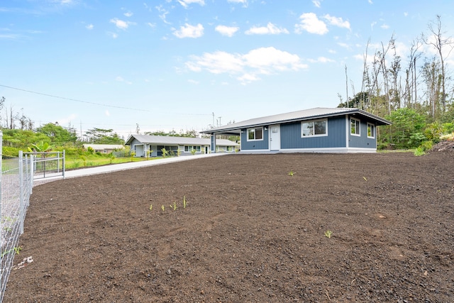 16-2168 Tree Fern Dr, Pahoa, HI 96778 - view of front facade with an attached carport and metal roof