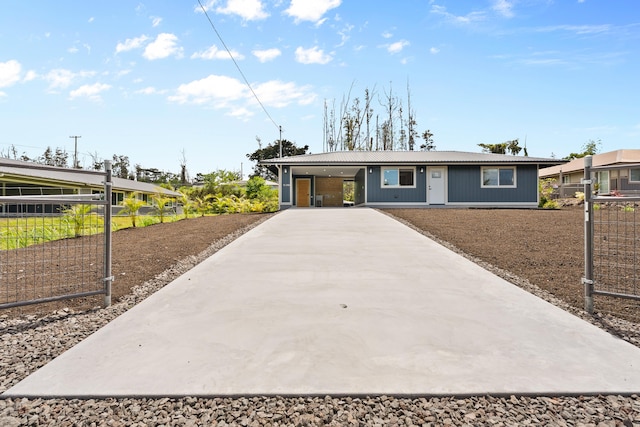 16-2168 Tree Fern Dr, Pahoa, HI 96778 - ranch-style house with concrete driveway, metal roof, and an attached carport
