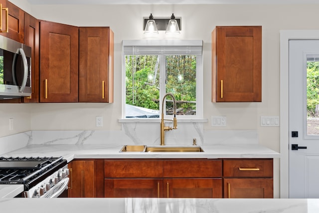 16-2168 Tree Fern Dr, Pahoa, HI 96778 - kitchen with appliances with stainless steel finishes, a sink, and light stone counters