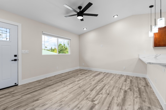 16-2168 Tree Fern Dr, Pahoa, HI 96778 - unfurnished living room with light wood finished floors, ceiling fan, recessed lighting, baseboards, and lofted ceiling