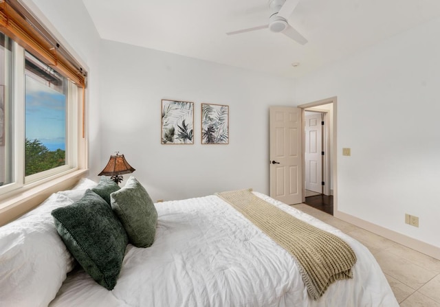 73-4566 Kukuki St, Kailua-Kona, HI 96740 - bedroom with light tile patterned flooring and ceiling fan