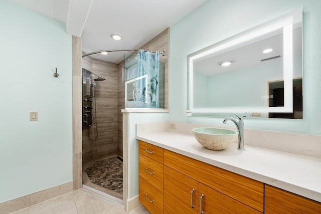 73-4566 Kukuki St, Kailua-Kona, HI 96740 - full bath with vanity, a tile shower, and tile patterned floors