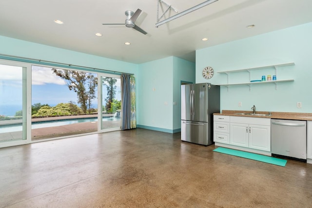 73-4566 Kukuki St, Kailua-Kona, HI 96740 - kitchen with dishwasher, freestanding refrigerator, concrete flooring, white cabinetry, and recessed lighting