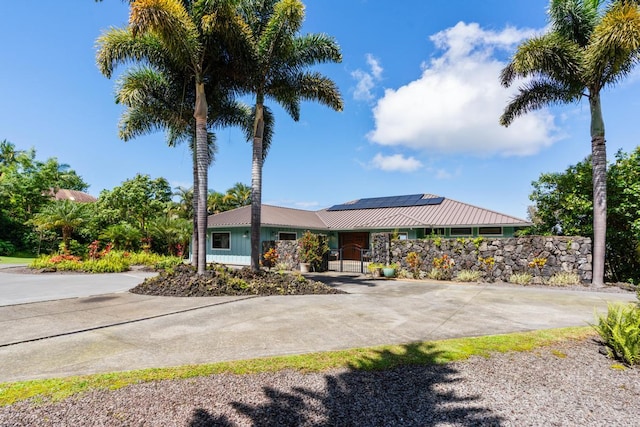 73-4566 Kukuki St, Kailua-Kona, HI 96740 - view of front facade featuring solar panels and a metal roof