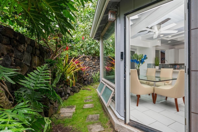 75-6150 Alii Dr Unit 8, Kailua-Kona, HI 96740 - doorway to outside with ceiling fan and tile patterned floors