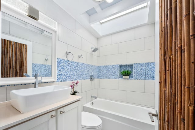 75-6150 Alii Dr Unit 8, Kailua-Kona, HI 96740 - bathroom with tile walls, tub / shower combination, vanity, toilet, and backsplash