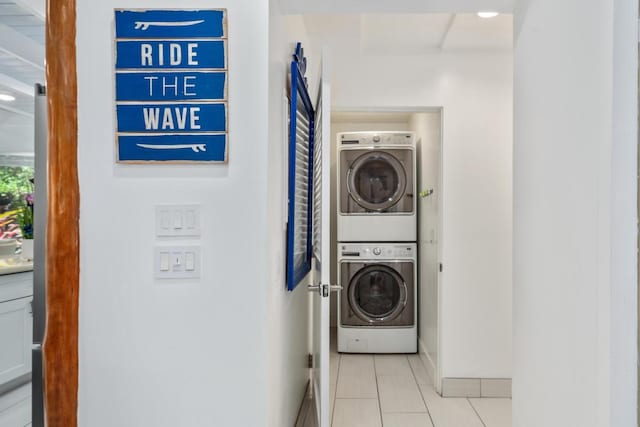 75-6150 Alii Dr Unit 8, Kailua-Kona, HI 96740 - washroom with stacked washer / dryer, tile patterned flooring, and baseboards