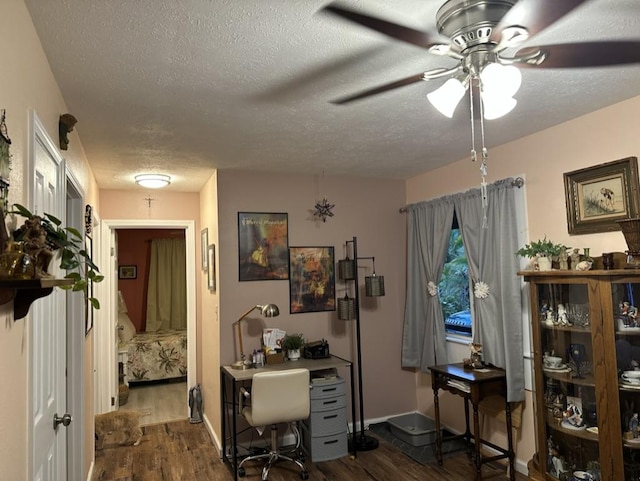 14-682 Kehau Rd, Pahoa, HI 96778 - office featuring dark wood-style floors, a textured ceiling, ceiling fan, and baseboards