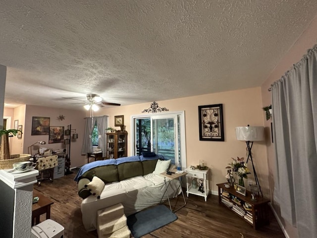 14-682 Kehau Rd, Pahoa, HI 96778 - living area with a textured ceiling, wood finished floors, ceiling fan, and baseboards