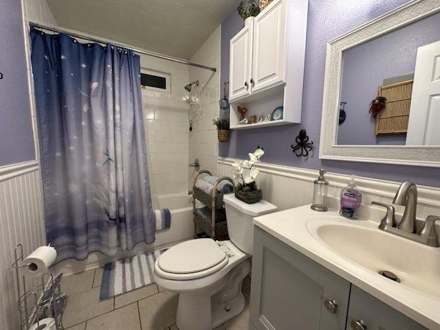 14-682 Kehau Rd, Pahoa, HI 96778 - bathroom featuring toilet, shower / bath combo with shower curtain, vanity, wainscoting, and tile patterned flooring