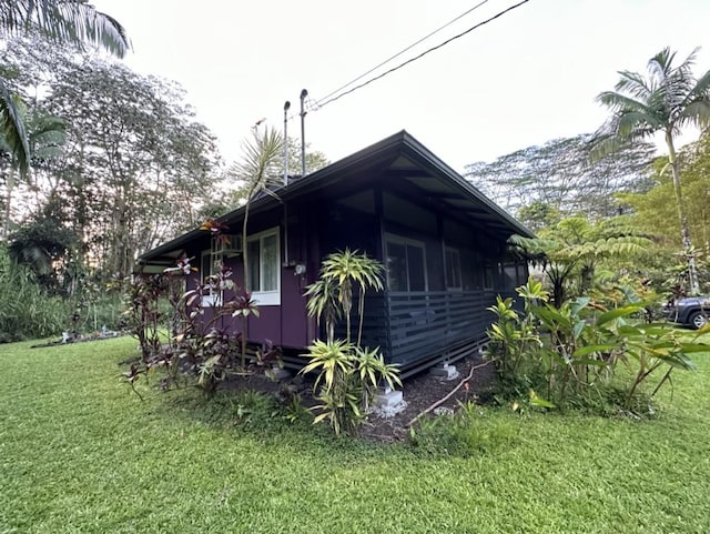 14-682 Kehau Rd, Pahoa, HI 96778 - view of property exterior with a lawn