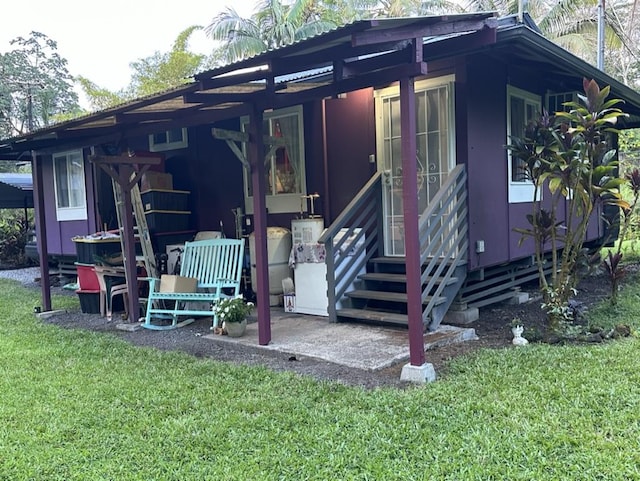 14-682 Kehau Rd, Pahoa, HI 96778 - view of front of home with a front lawn and a patio