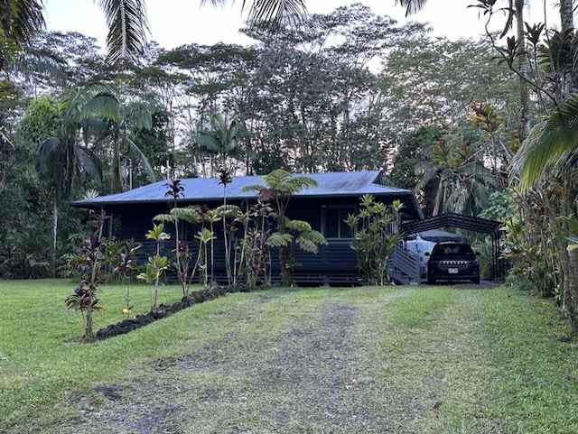 14-682 Kehau Rd, Pahoa, HI 96778 - view of front facade with a front lawn, a detached carport, and driveway
