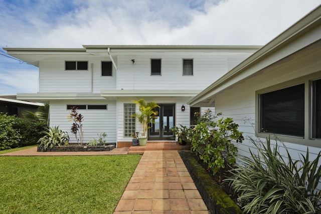 724-B Wainaku St, Hilo, HI 96720 - view of front of house with french doors and a front yard
