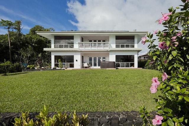 724-B Wainaku St, Hilo, HI 96720 - back of property with a balcony, french doors, a yard, and a sunroom