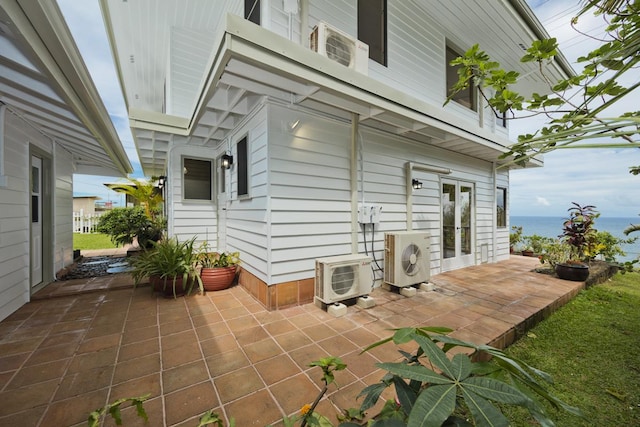 724-B Wainaku St, Hilo, HI 96720 - view of patio / terrace with ac unit and a water view